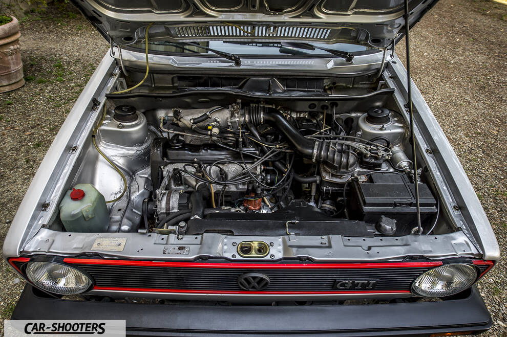 engine bay, open hood showing engine components