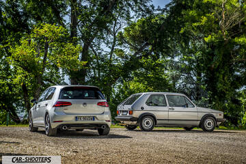 rear three-quarter, silver on a gravel path