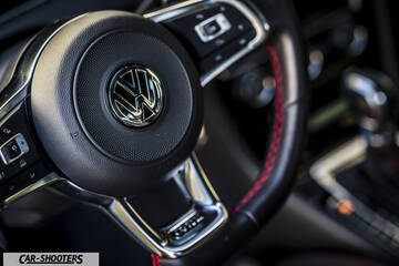 dashboard, leather steering wheel with red stitching