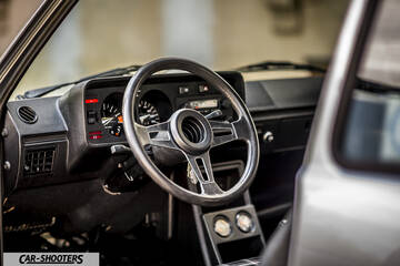 dashboard, classic black dashboard with a three-spoke steering wheel