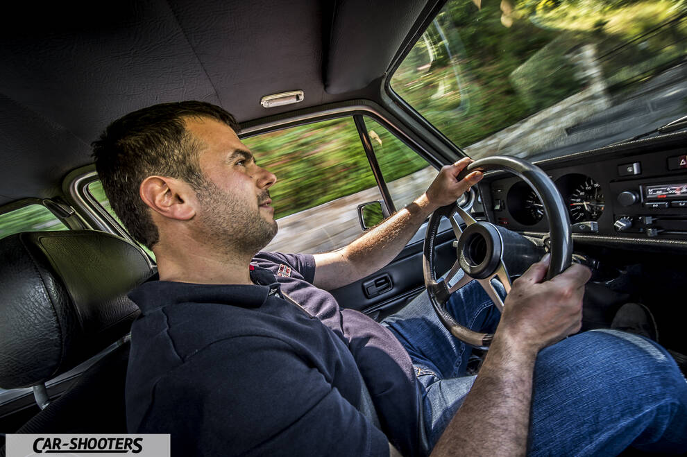 interior, driver holding steering wheel