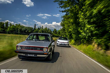 front three-quarter, silver on a country road