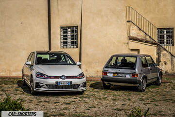 front three-quarter, silver against a rustic wall