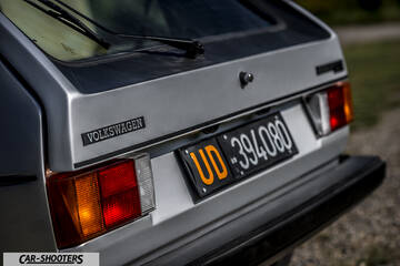 rear view, silver against an outdoor backdrop