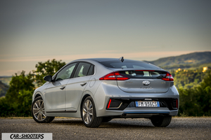 Hyundai Ioniq – rear three-quarter, silver metallic against a mountain backdrop