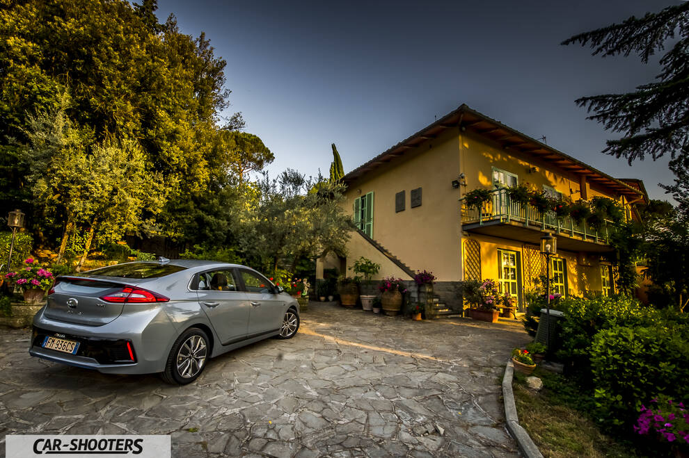 Hyundai Ioniq – rear three-quarter, silver parked on a stone courtyard
