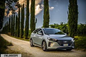 Hyundai Ioniq – front three-quarter, silver on a country road