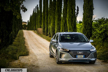 Hyundai Ioniq – front three-quarter, silver on a country road
