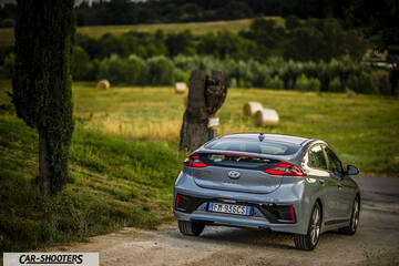 Hyundai Ioniq – rear three-quarter, silver on a country road