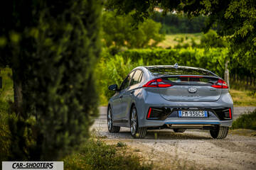 Hyundai Ioniq – rear three-quarter, grey on a country road