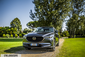 Mazda CX 5 – front three-quarter, dark grey metallic on a dirt path