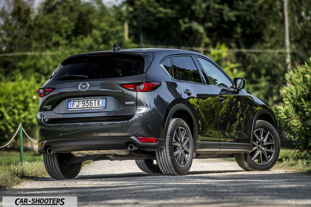 Mazda CX 5 – rear three-quarter, dark grey metallic on a country road