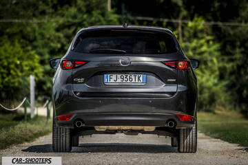 Mazda CX 5 – rear view, dark grey on a country road