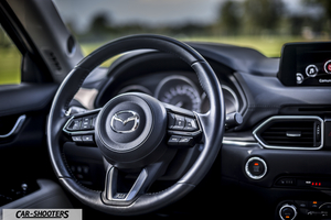 Mazda CX 5 – dashboard, leather steering wheel and infotainment screen