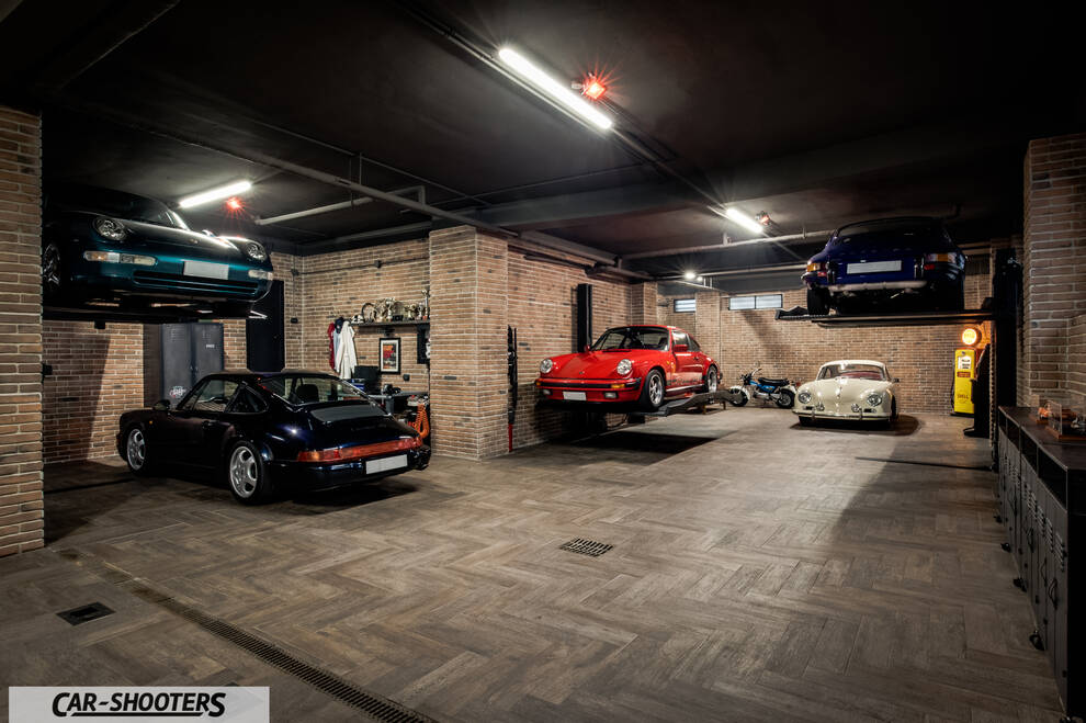 Porsche – front three-quarter, red in a multi car garage