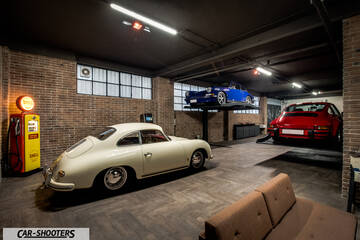 Porsche – rear three-quarter, off white in a classic garage