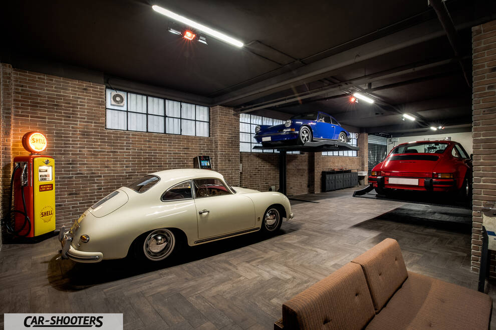Porsche – rear three-quarter, off white in a classic garage
