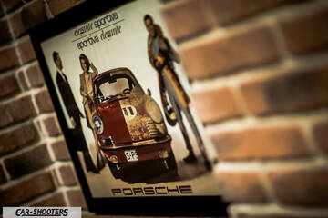 Porsche – detail, framed poster on a brick wall