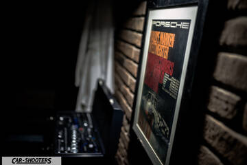Porsche – detail, framed poster on a brick wall
