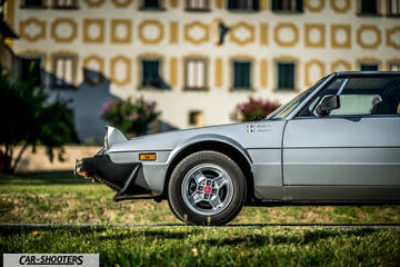 Fiat X1 9 Storia – side profile, silver parked on grass in front of a building