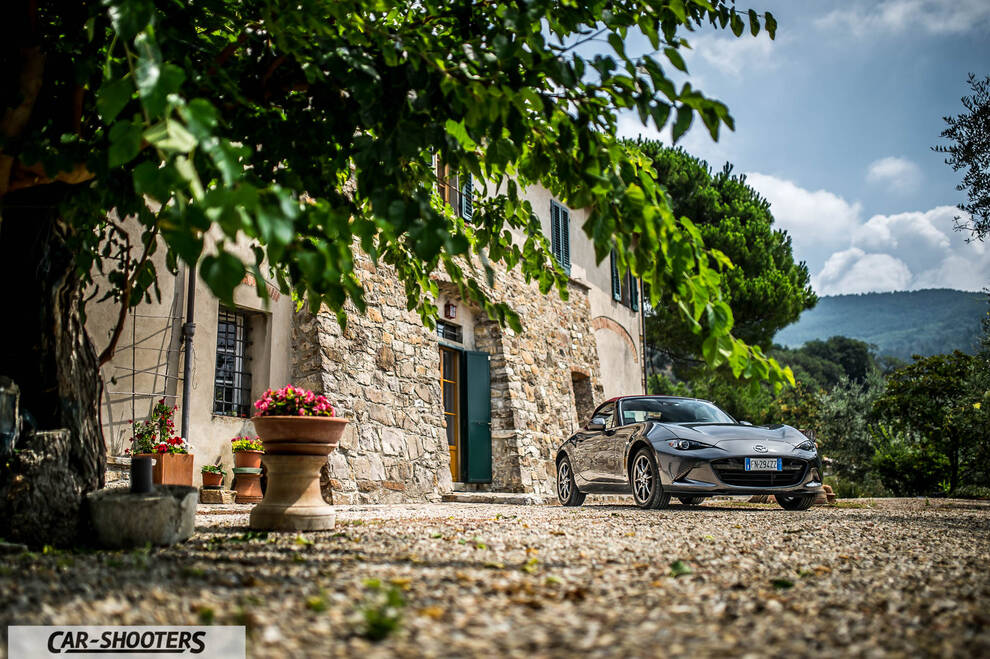 Mazda MX 5 Cherry Edition – front three-quarter, grey metallic parked outside a stone building