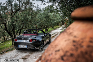 Mazda MX 5 Cherry Edition – rear three-quarter, grey metallic on a country road