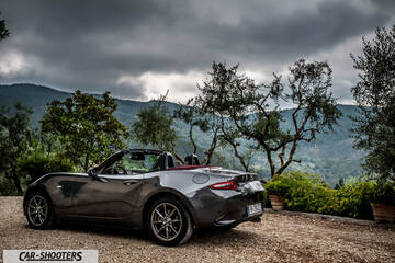 Mazda MX 5 Cherry Edition – rear three-quarter, grey metallic against a mountain backdrop
