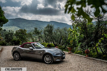 Mazda MX 5 Cherry Edition – front three-quarter, grey metallic against a mountain backdrop