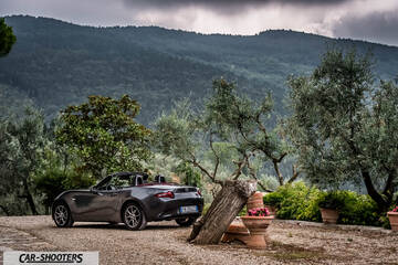 Mazda MX 5 Cherry Edition – rear three-quarter, grey metallic against a mountain backdrop