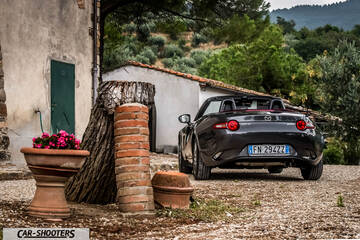 Mazda MX 5 Cherry Edition – rear three-quarter, grey metallic against a rustic background