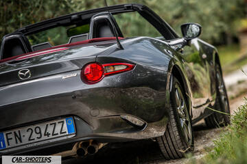 Mazda MX 5 Cherry Edition – rear three-quarter, grey metallic on a country road
