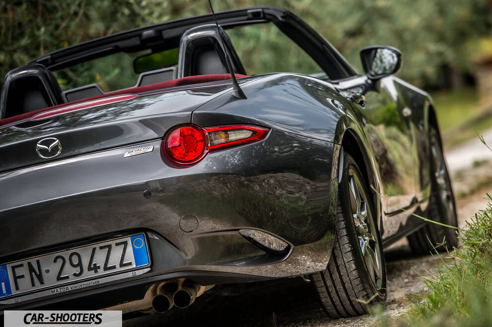 Mazda MX 5 Cherry Edition – rear three-quarter, grey metallic on a country road