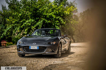 Mazda MX 5 Cherry Edition – front three-quarter, grey metallic on a gravel path