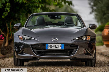 Mazda MX 5 Cherry Edition – front three-quarter, grey metallic on a gravel driveway
