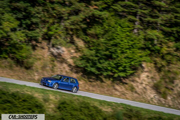 Volkswagen Golf R – front three-quarter, blue on a winding mountain road