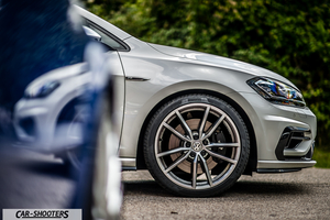 Volkswagen Golf R – front three-quarter, silver alloy wheel close-up on pavement