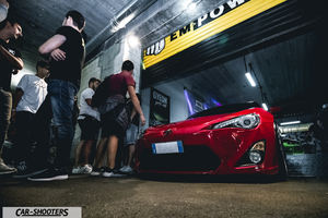 front three-quarter, red in a garage