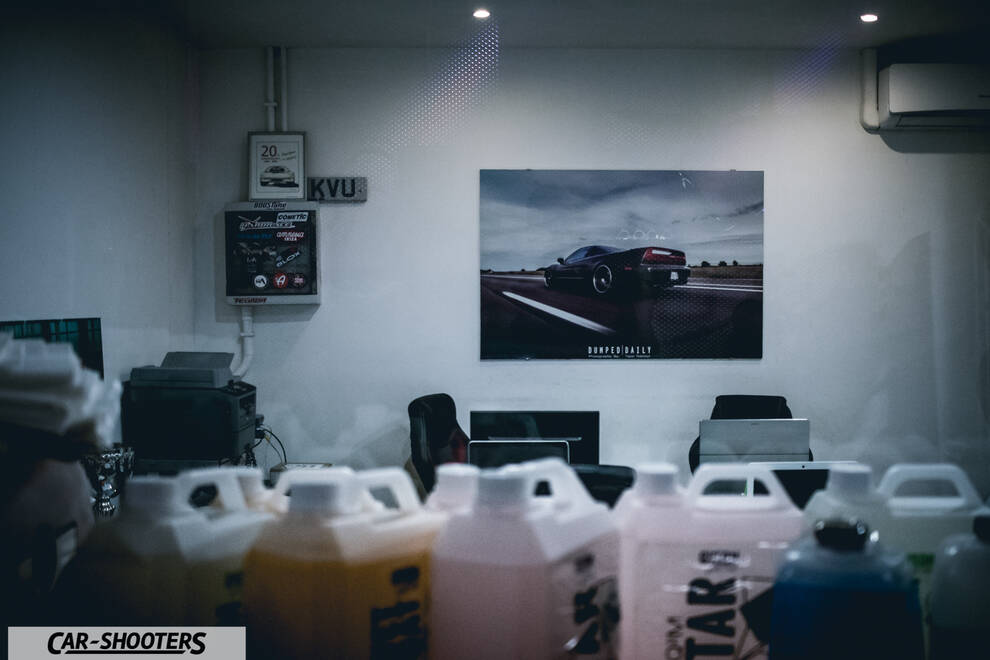 detail, in a workshop with fluid jugs