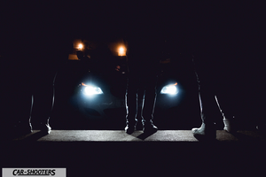 front three-quarter, in low light with people standing