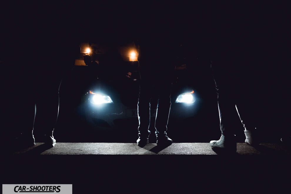 front three-quarter, in low light with people standing