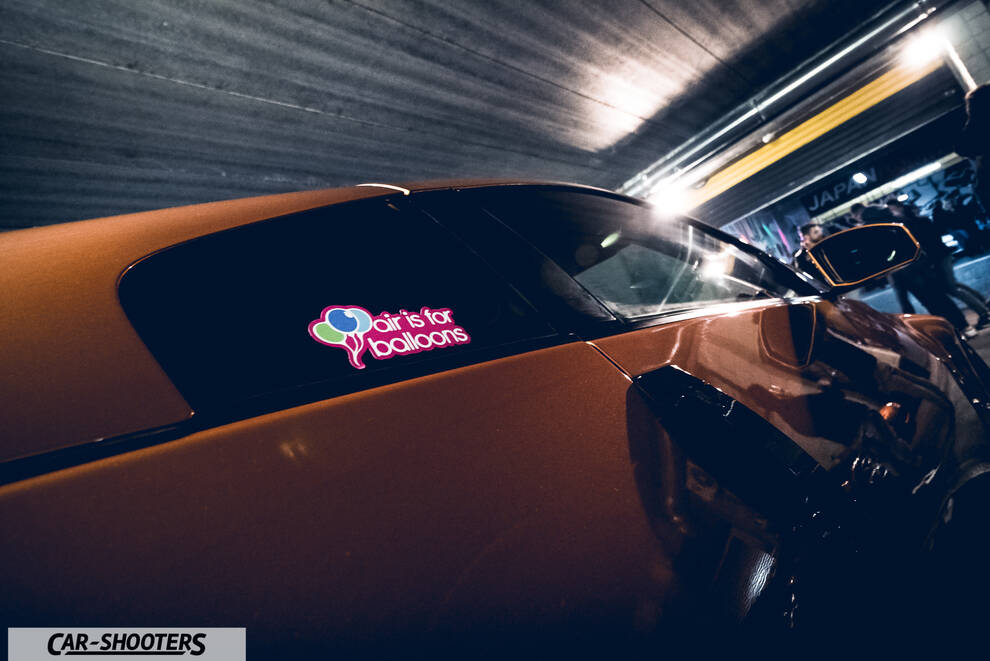 side profile, yellow with a window sticker