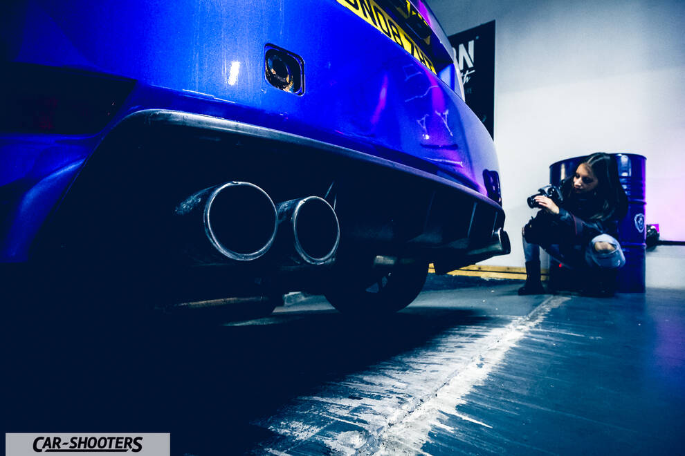 rear view, blue in an indoor garage