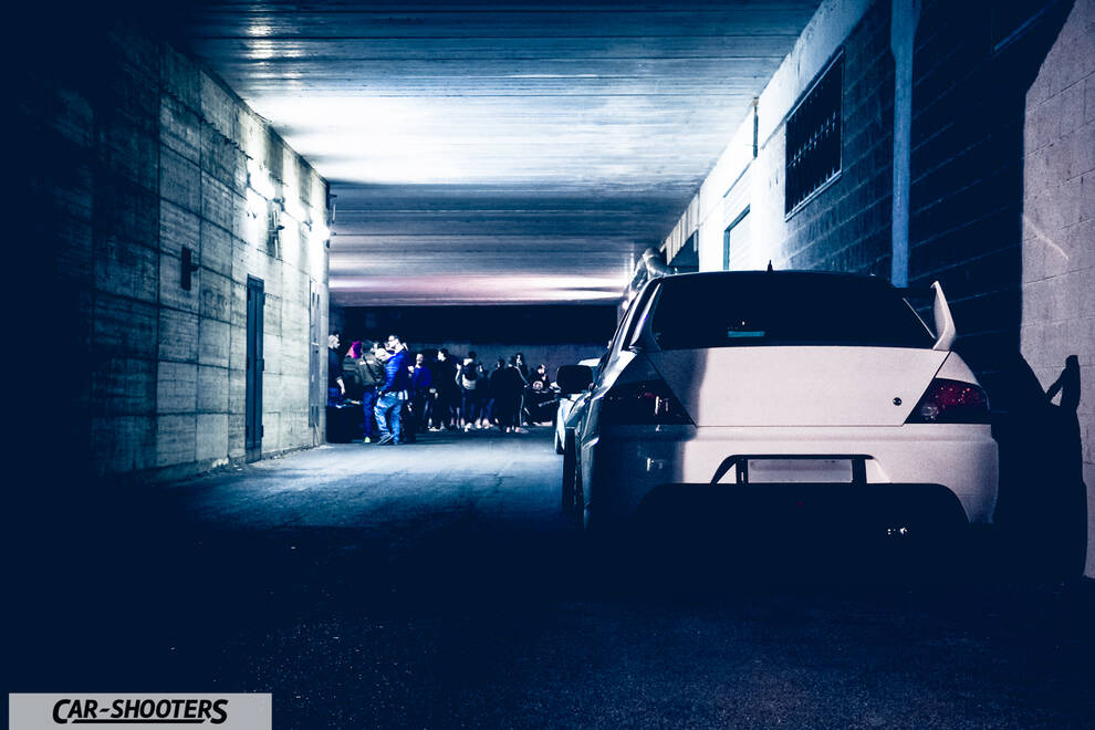 rear view, white in an underpass at night