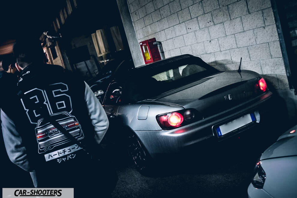 rear three-quarter, silver in a tight garage space