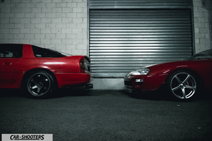 side profile, red in front of a garage door