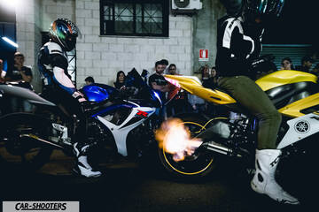 side profile, yellow with exhaust flames in a garage