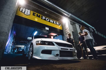 front three-quarter, white in a garage