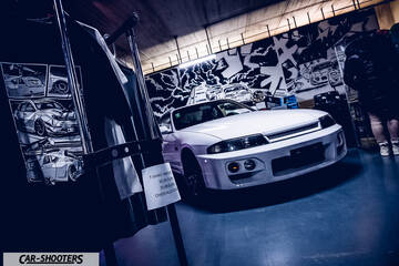 front three-quarter, white in an indoor garage