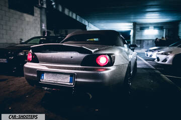 rear three-quarter, silver in an underground parking garage