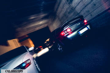 rear three-quarter, silver in a concrete underpass